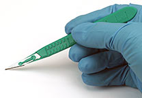 Disposable scalpel in use.