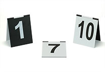 Number signs (several number ranges available), tent design, with hinge on the top. Black with white printing on one half, white with black printing on the other half. Dimensions: 9 x 11 cm.